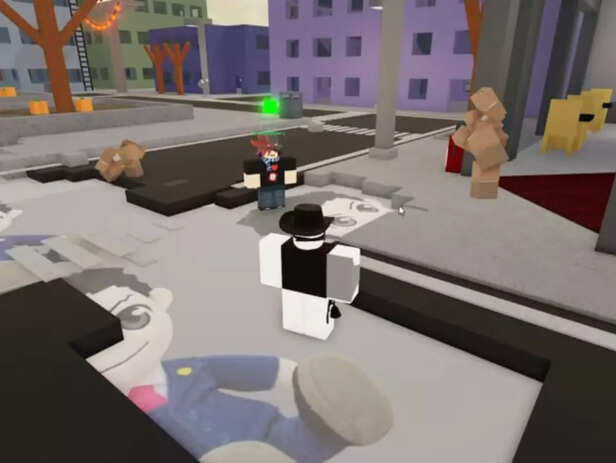 Jujutsu Shenanigans Halloween gameplay screenshot showing Roblox avatars in a city area