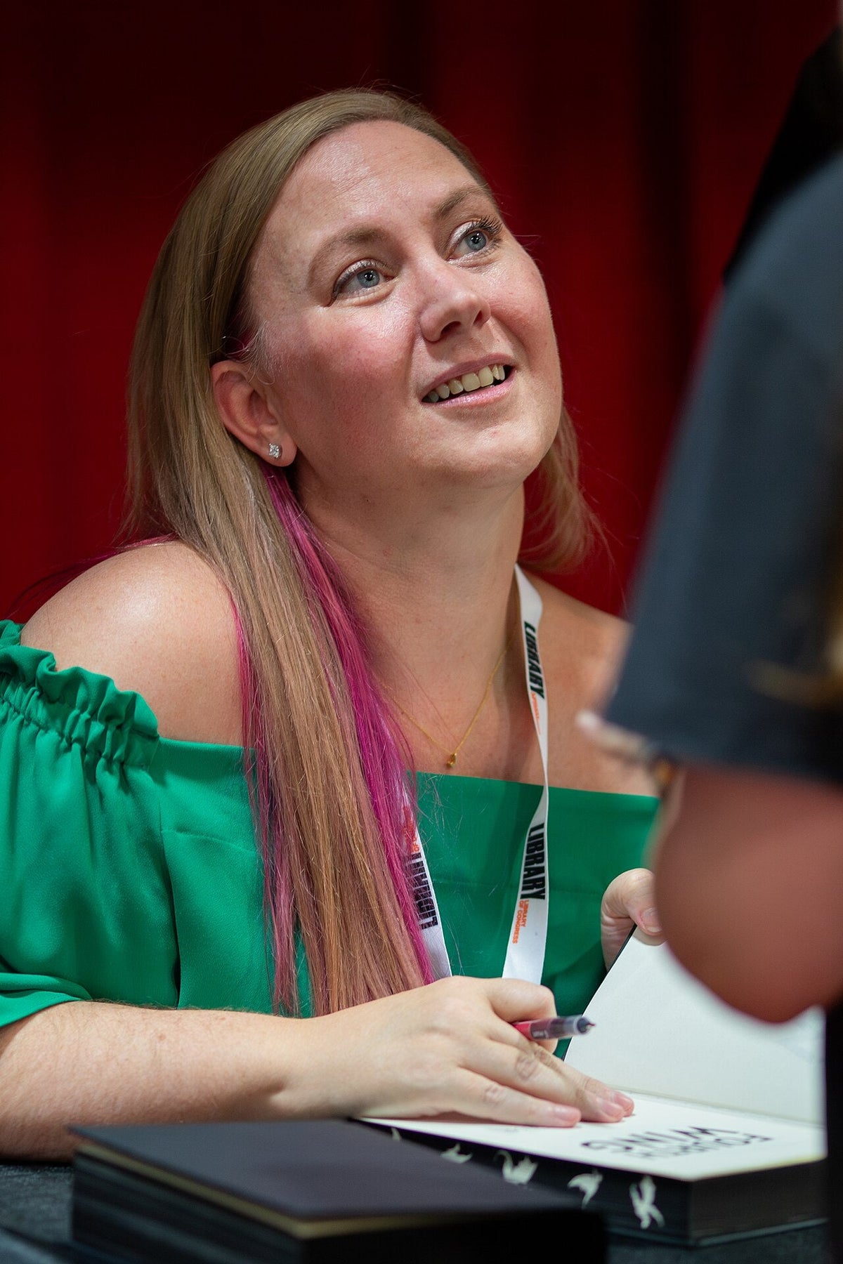 Rebecca Yarros at the 2024 United States National Book Festival, featured image for Fourth Wing adaptation casting coverage