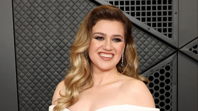 Kelly Clarkson pictured at a formal event; file photo for coverage of the Art of Play store dispute