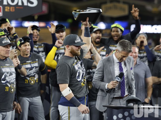 Jake Bauers holds the NLCS MVP trophy after the Milwaukee Brewers defeat the Los Angeles Dodgers on October 15, 2026
