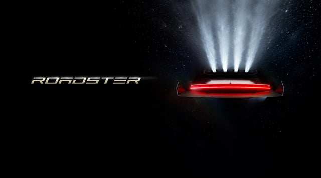 Tesla Roadster reveal teaser showing the rear design under dramatic lighting; teaser image, not event footage