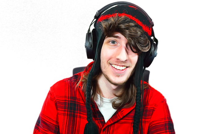 Roblox creator KreekCraft in a red plaid shirt and headphones, one of the creators scheduled for The Hollow finale livestream