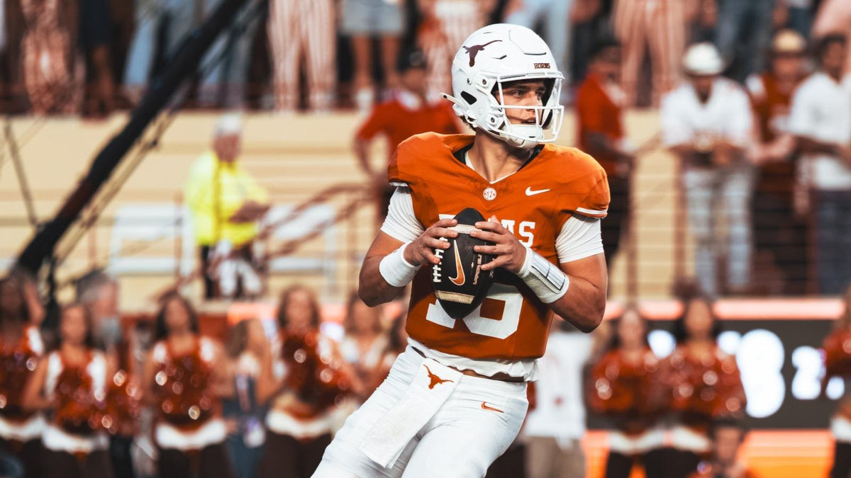 Texas Longhorns quarterback Arch Manning scans the field during a game