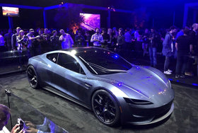 Tesla Roadster prototype displayed at an earlier reveal event; historical image, not the October 2026 flying demonstration