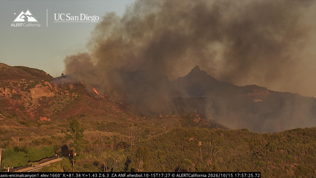 Smoke and flames visible on a Malibu hillside during the Bryson Fire on October 15, 2026; ALERTCalifornia camera image