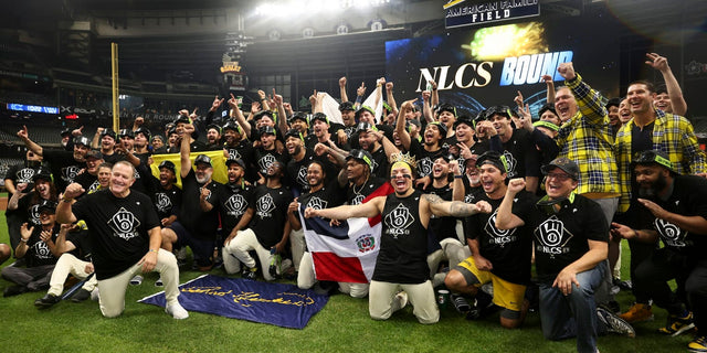 Milwaukee Brewers players celebrate earning an NLCS berth, illustrating the team's rise from underdog to World Series contender
